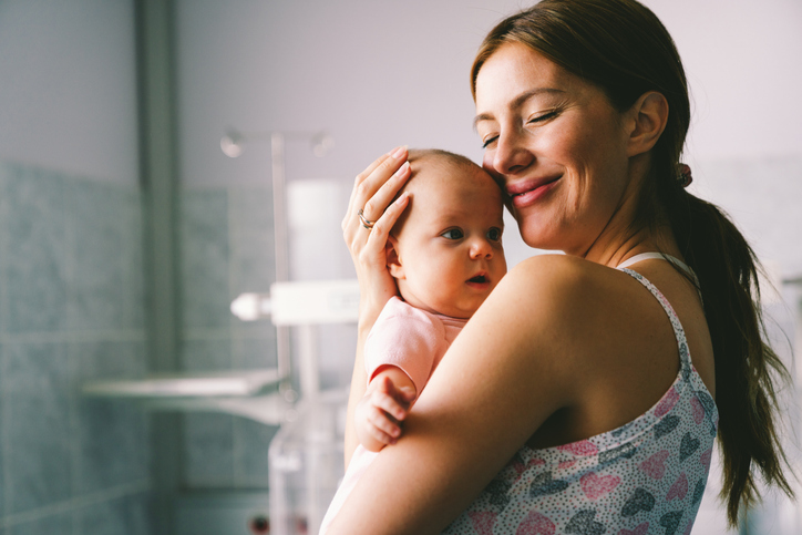portrait of a mother with her newborn baby