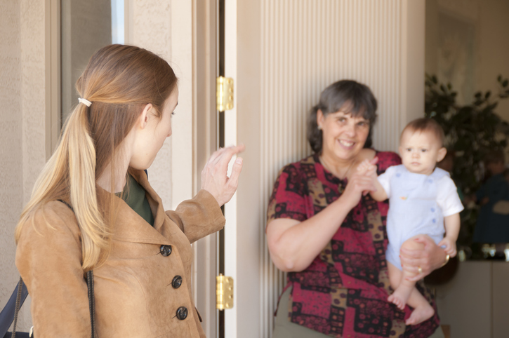 young mom leaves baby with sitter
